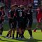 DC United Captain Dwayne De Rosario celebrates a 2-0 win with his teammates against his old team at BMO Field. In the background frustrated Toronto FC forward Ryan Johnson walks off the pitch (JP Dhanoa)